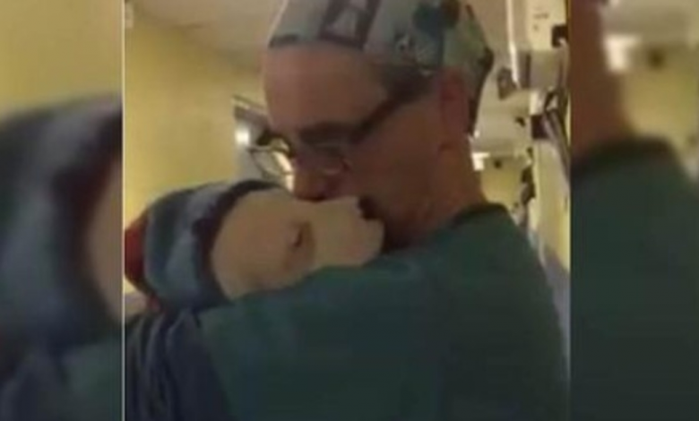 Veterinarian Cradles Frightened and Crying Rescue Puppy Just Like a Baby After Surgery